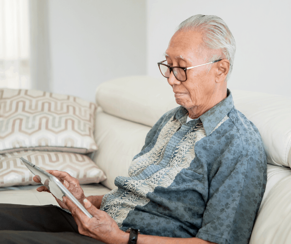 Elderly Gentleman using a tablet