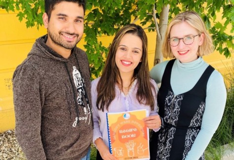 Devonport couple Sachet Devkota and Deepa Bhattrai and Devonport City Council Events Officer Eleanor McCormack with the first draft of the Harmony Week Devonport Recipe Book. Devonport residents are encouraged to submit their recipes by Monday.