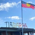 Aboriginal Flag flying above Tiagarra Aboriginal Cultural Centre