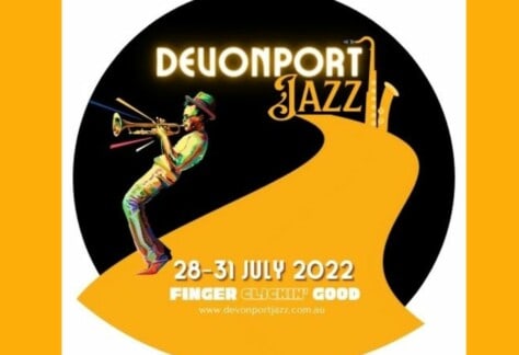 A black and yellow graphic promoting this year's Devonport Jazz festival. It features a man playing a trumpet.