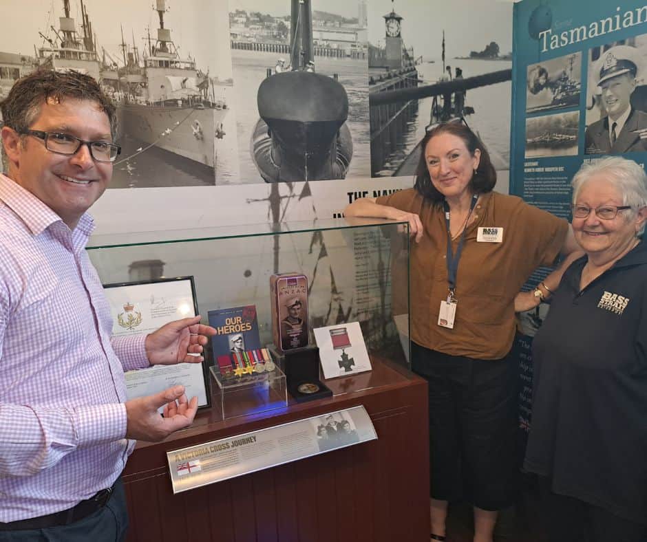 Bass Strait Maritime Centre volunteer Helen Anderson (right) with Devonport City Council’s Convention and Arts Centre Manager Geoff Dobson and BSMC Coordinator Joanna Gair, admire the new Teddy Sheean display. A volunteer’s breakfast will be held on Tuesday, 6 December from 7-9am.
