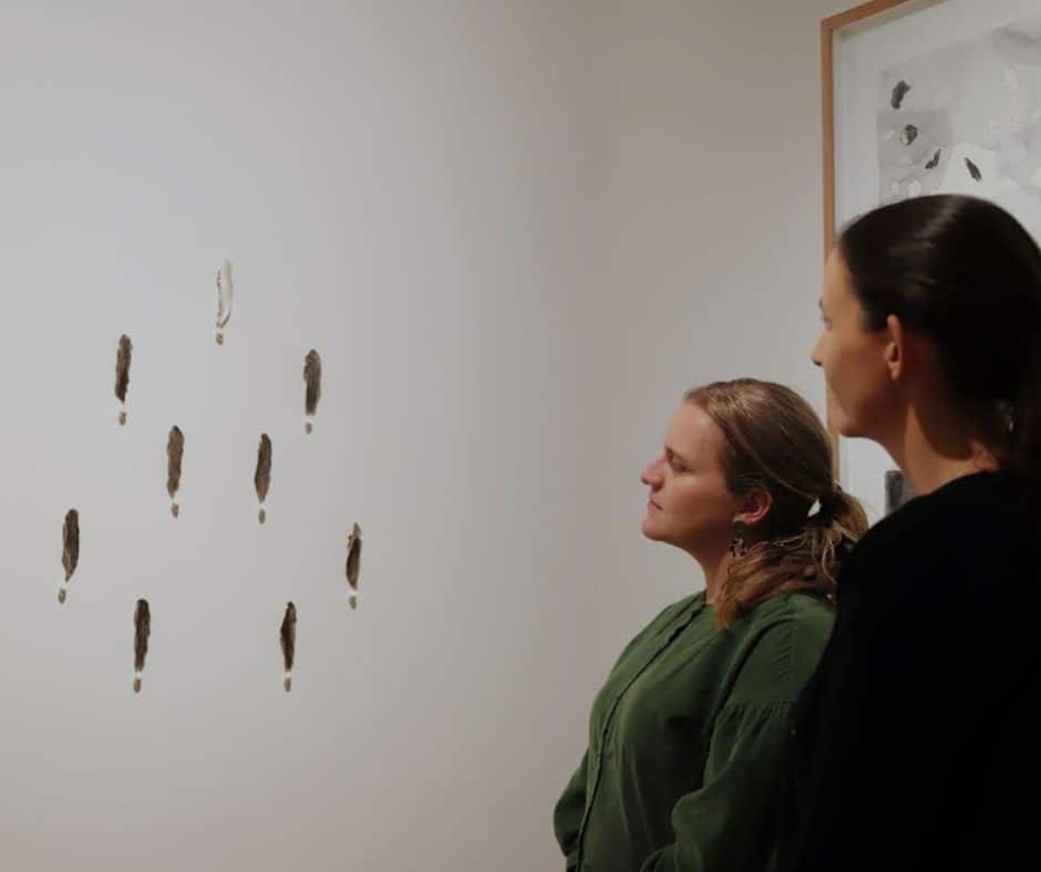 : The winning work of tidal.20 Kelp Elegy, by Janine Combes, admired by then Ellina Evans, Curator Devonport Regional Gallery and Eve Williams, Creative lerning and Public Programs Officer.