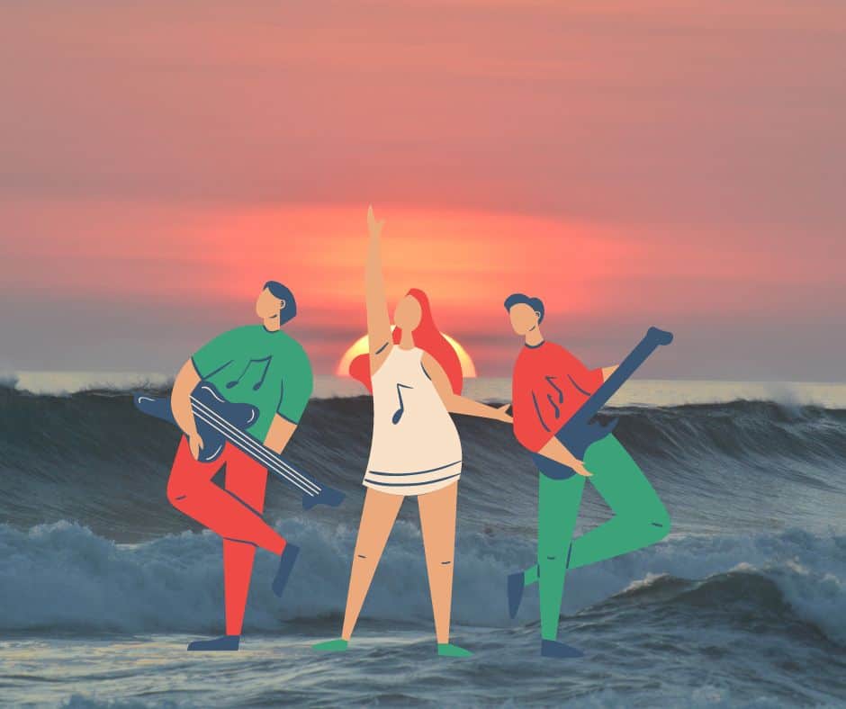 Image shows three members of a band in front of the ocean
