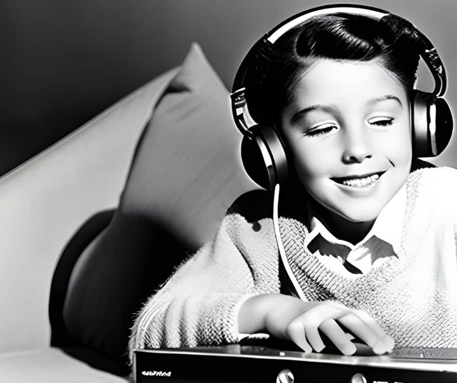 Black and white image of someone listening to the radio