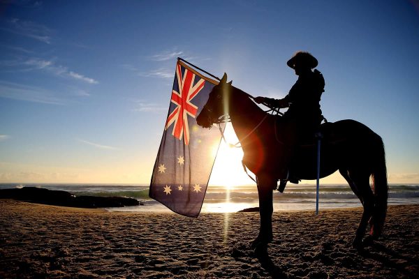 GOLD COAST, AUSTRALIA - APRIL 25:  A member of the Mudgeeraba light horse troop takes part in the ANZAC dawn service at Currumbin Surf Life Saving Club on April 25, 2014 in Gold Coast, Australia. Veterans, dignitaries and members of the public today marked the 99th anniversary of ANZAC (Australia New Zealand Army Corps) Day, April 25, 1915 when allied First World War forces landed on the Gallipoli Peninsula. A public holiday in both Australia and New Zealand, commemoration events are held across both countries in remembrance of those who fought and died in all wars.  (Photo by Chris Hyde/Getty Images)